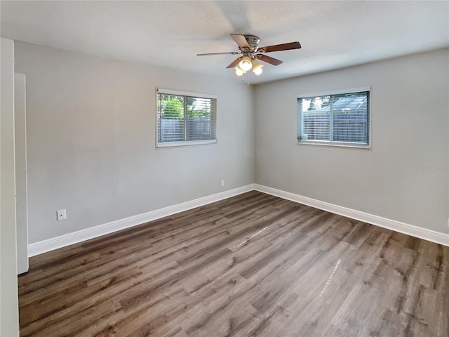 spare room featuring hardwood / wood-style flooring and a wealth of natural light