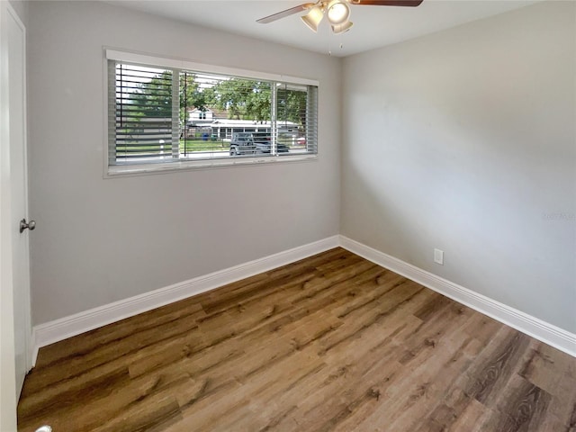 unfurnished room with ceiling fan and hardwood / wood-style floors