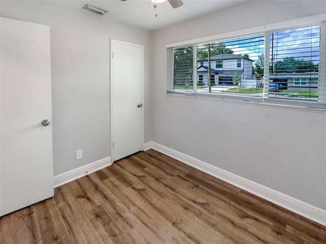 unfurnished room featuring hardwood / wood-style flooring and ceiling fan