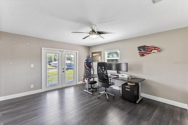 home office with ceiling fan, french doors, dark wood-type flooring, and a textured ceiling