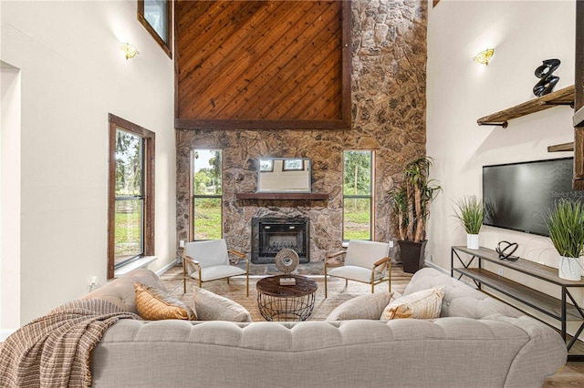 living room featuring a high ceiling and a fireplace