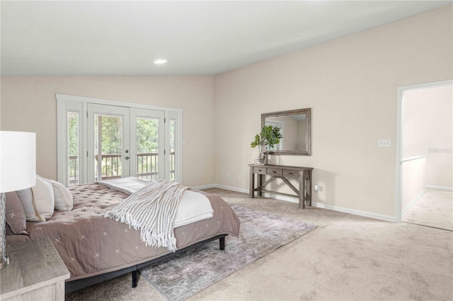 bedroom with carpet floors, access to exterior, french doors, and vaulted ceiling