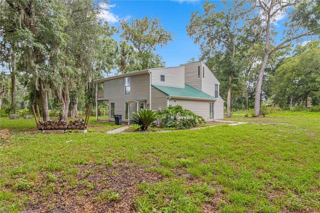 view of side of property with a yard