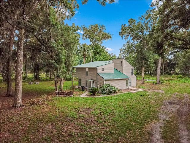 back of house with a yard