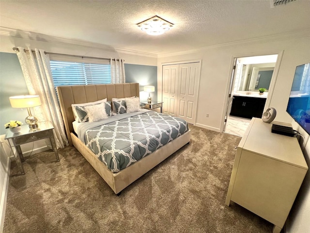 bedroom with connected bathroom, crown molding, dark carpet, and a textured ceiling