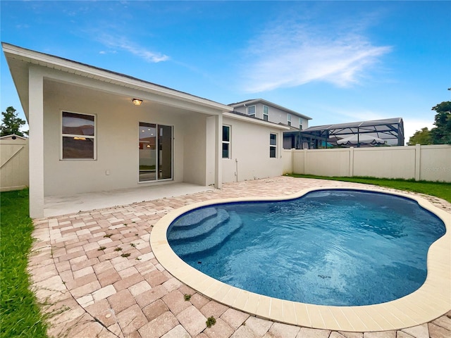 view of swimming pool with a patio area