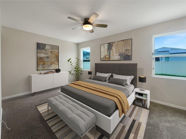 bedroom with dark colored carpet and ceiling fan