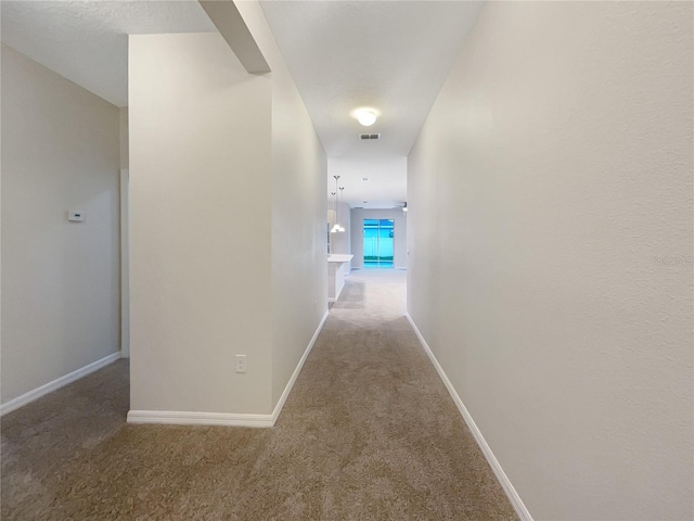 corridor featuring carpet