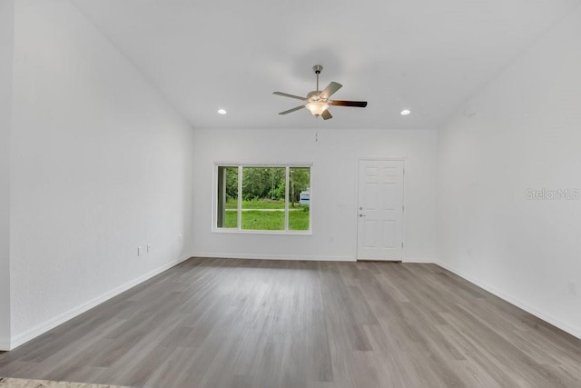 297 Malauka Run, Ocklawaha, FL 32179 - empty room featuring ceiling fan and light hardwood / wood-style floors