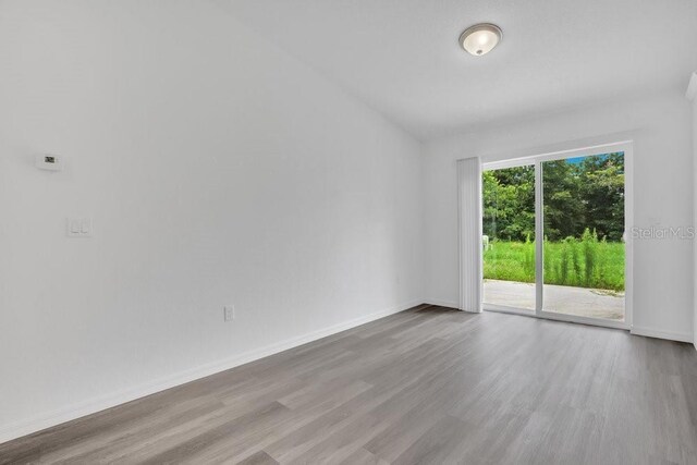 spare room featuring hardwood / wood-style floors