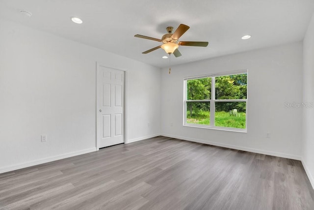 297 Malauka Run, Ocklawaha, FL 32179 - empty room with ceiling fan and light hardwood / wood-style flooring