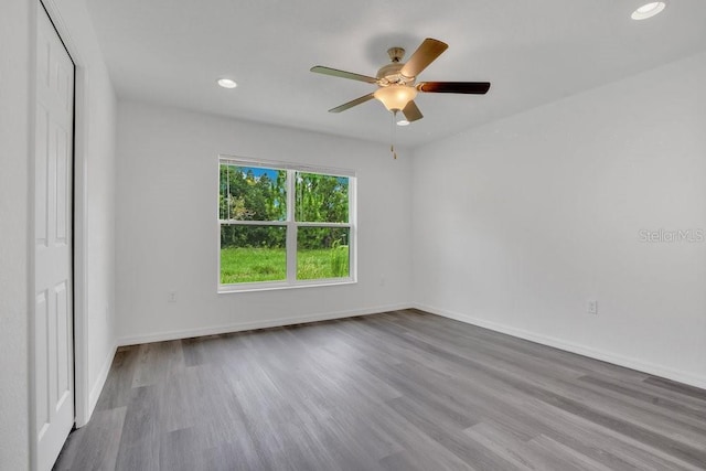 unfurnished room featuring wood-type flooring and ceiling fan