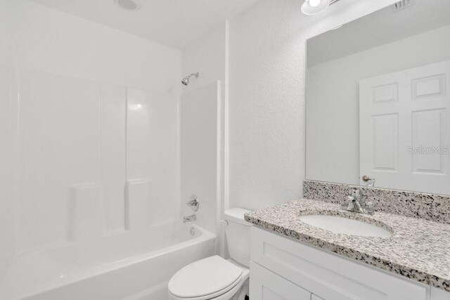 full bathroom with vanity, toilet, and bathtub / shower combination