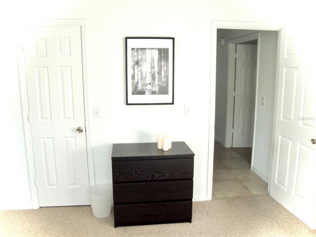 hallway with light tile patterned floors