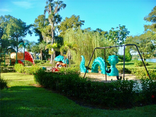 view of playground featuring a lawn