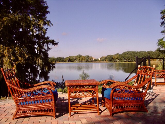 wooden deck with a water view