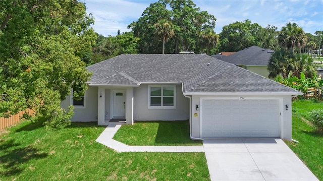 single story home with a front yard and a garage