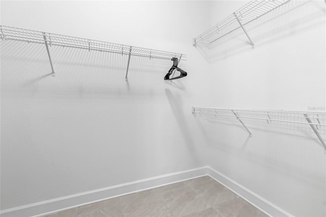 walk in closet featuring tile patterned floors