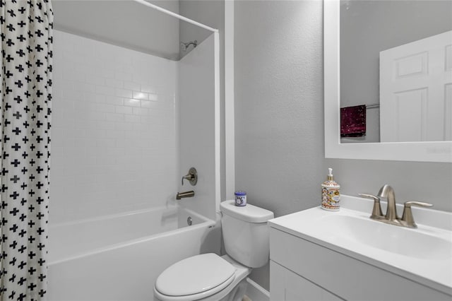 full bathroom with vanity, toilet, and tiled shower / bath