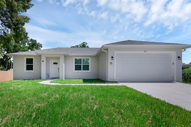 ranch-style home featuring a front yard and a garage