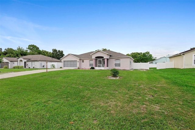 single story home featuring a front yard and a garage