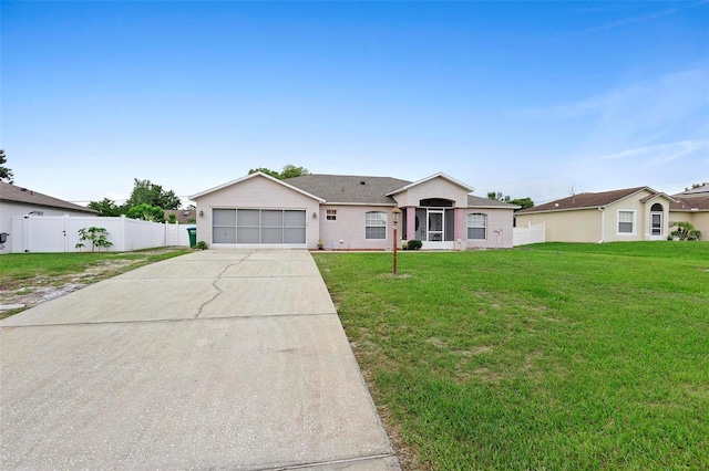 ranch-style home featuring a garage and a front lawn