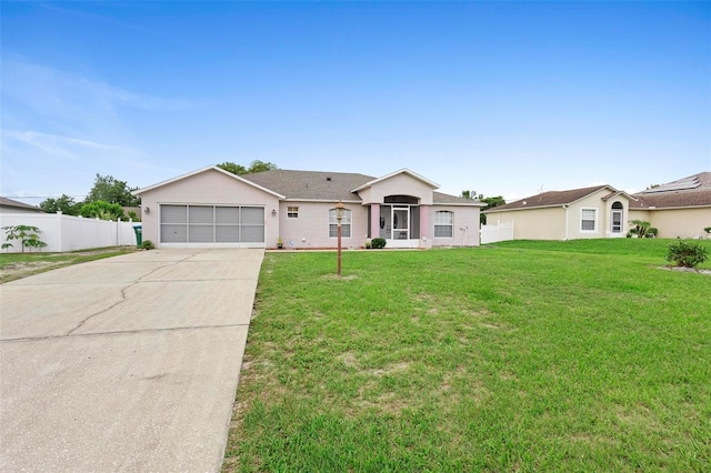 single story home with a front lawn and a garage