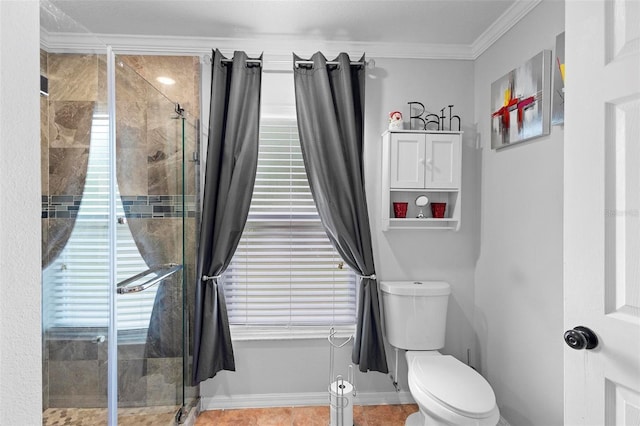 bathroom with toilet, tile patterned floors, a shower with door, and ornamental molding