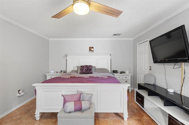 tiled bedroom featuring a textured ceiling, ceiling fan, and crown molding