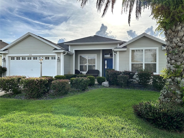 view of front of house with a garage and a front yard