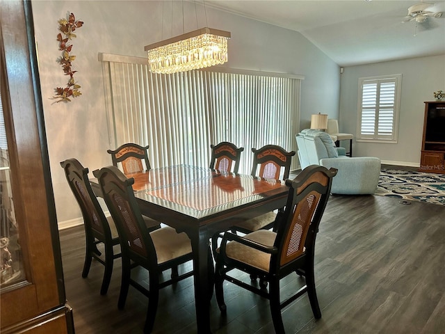 dining area featuring vaulted ceiling, dark hardwood / wood-style floors, and an inviting chandelier