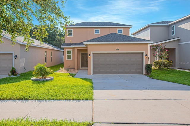 view of front property featuring a front lawn and a garage