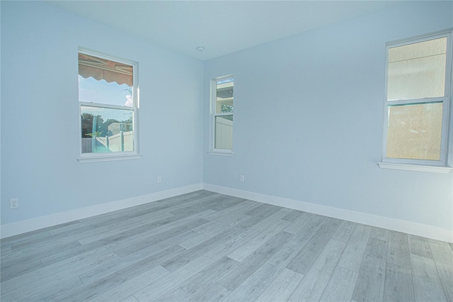 empty room with light wood-type flooring