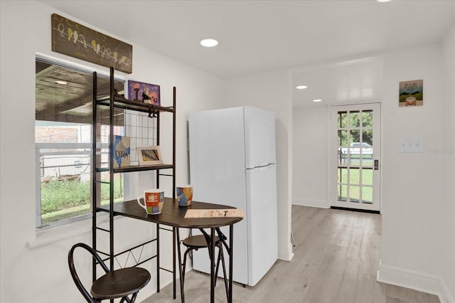 kitchen featuring light wood-type flooring and white refrigerator