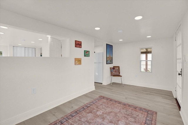 spare room featuring light hardwood / wood-style floors