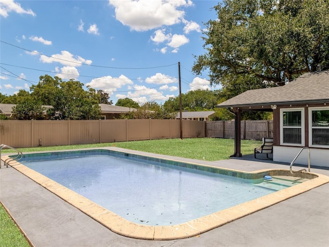 view of swimming pool with a yard, a patio area, a fenced backyard, and a fenced in pool