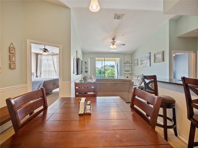 dining room featuring ceiling fan and vaulted ceiling