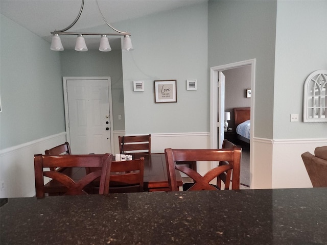 dining area with vaulted ceiling