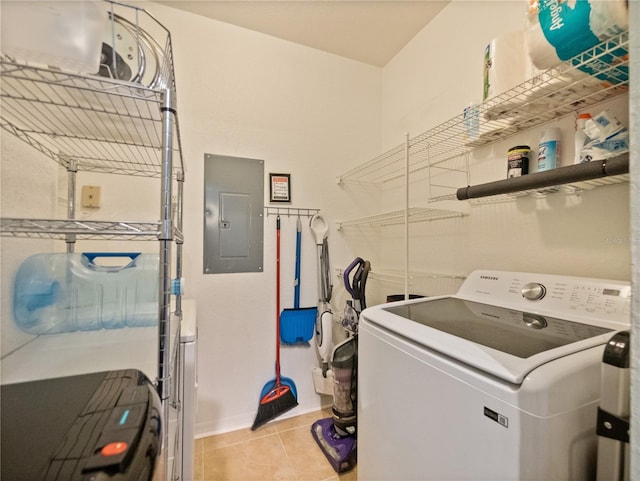 laundry room featuring washer / clothes dryer and light tile floors