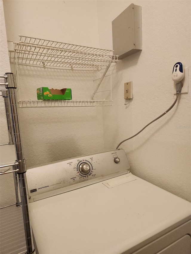 washroom with washer / clothes dryer