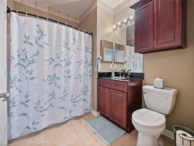 bathroom with walk in shower, tile patterned floors, vanity, and toilet