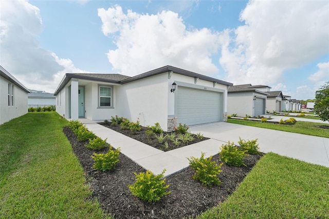 view of front of property with a front lawn and a garage