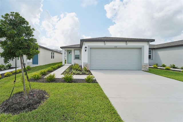 view of front of home with a front lawn and a garage