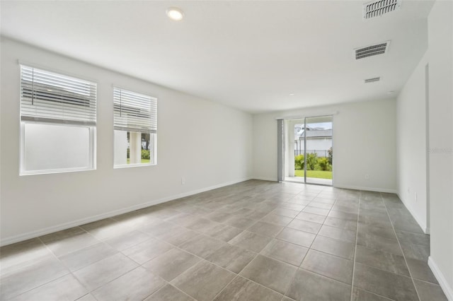 view of tiled spare room