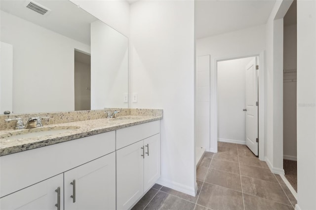 bathroom featuring tile patterned floors and vanity