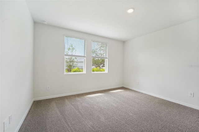 empty room featuring carpet flooring