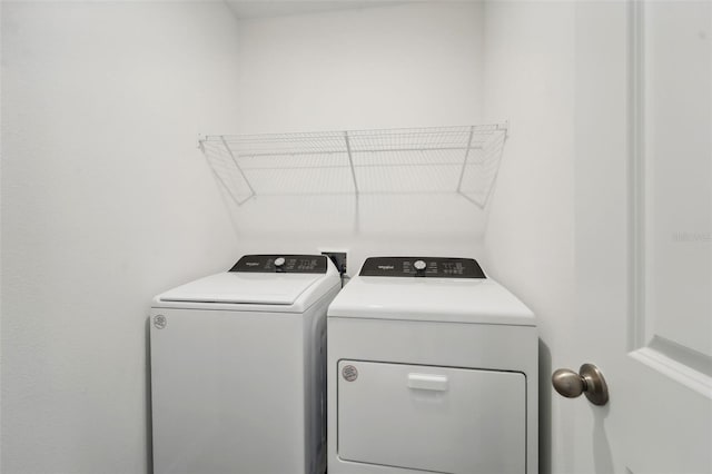 laundry room with washing machine and clothes dryer