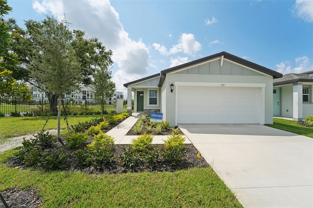 single story home with a front lawn and a garage