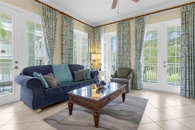 sunroom with ceiling fan, plenty of natural light, and french doors