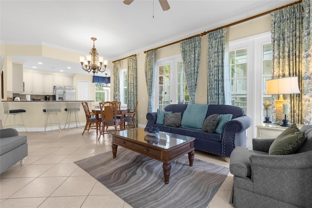 living room featuring light tile patterned floors, french doors, ceiling fan with notable chandelier, and crown molding